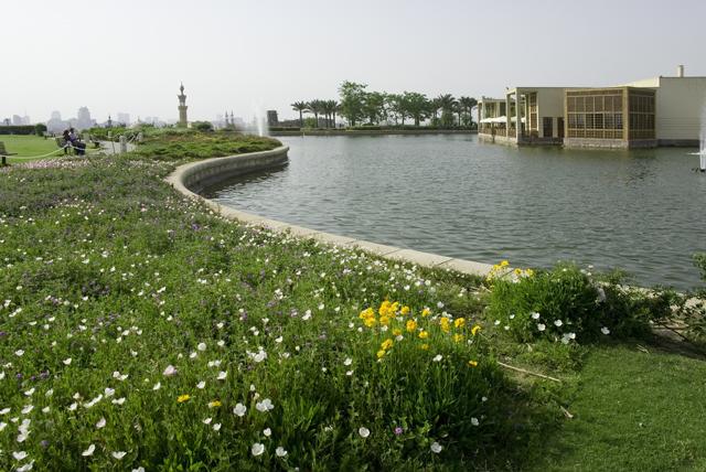 Al-Azhar Park - View along planting and lake's edge with Cafe in the background