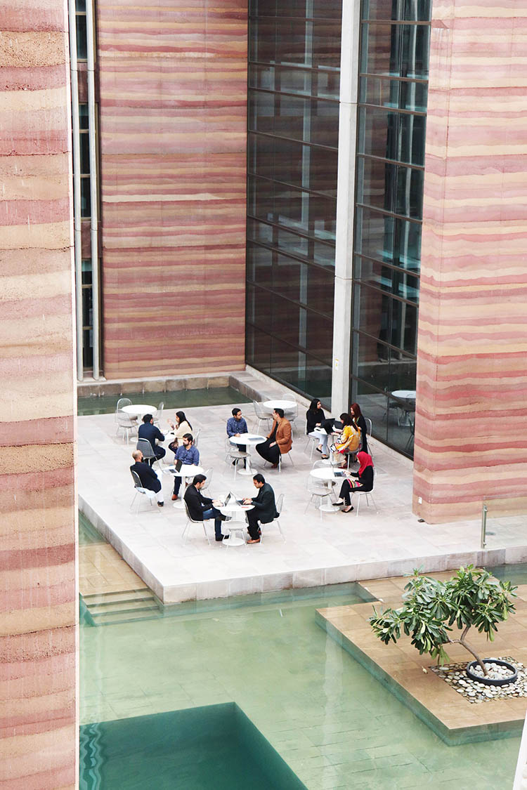 <p>Outdoor meeting in the Stepped Well Court</p>