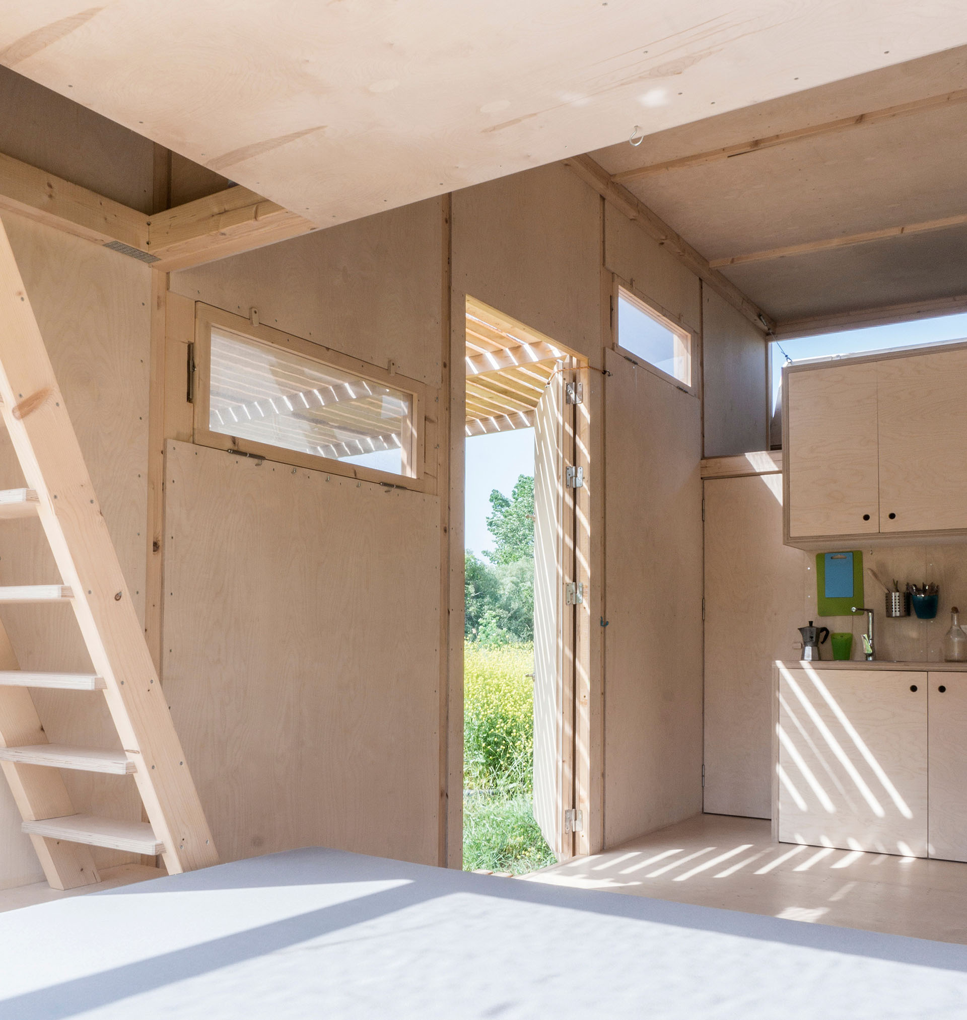 <p>Interior. Cabin on the Border is a tiny, transportable, prefabricated and affordable off-grid living unit for 4-6 people. It is located in a village near the border of Turkey and Greece.</p>