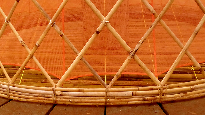 Detail of the connection point between stone base and bamboo frame structure