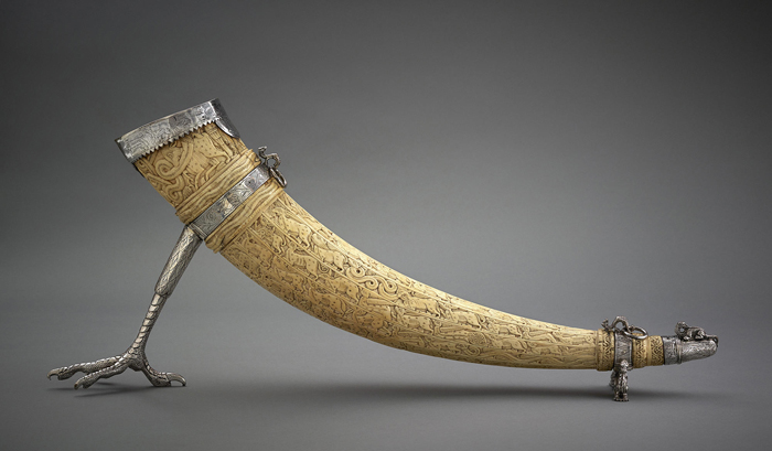 Carved ivory horn with silver mount