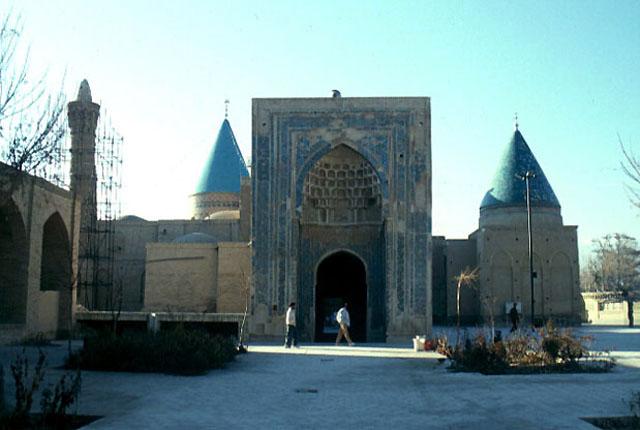 Exterior view of the east elevation of the complex, showing the entrance iwan at the center, Gunbad-i Ghazan Khan on the right and the dome of Imamzade Mohammad and the minaret of the mosque on the left