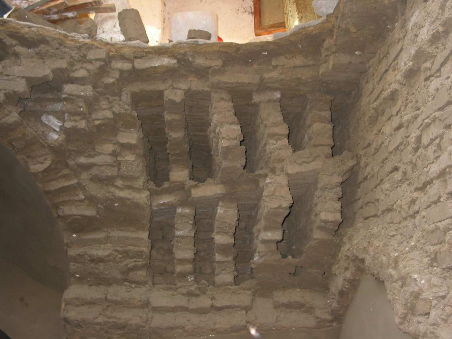 Cross section of dome infill visible after collapse