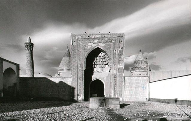 Exterior view of the east elevation, showing the entrance iwan in the foreground, Gunbad-i Ghazan Khan on the right and the Imamzade Mohammad dome and the minaret of the mosque on the left