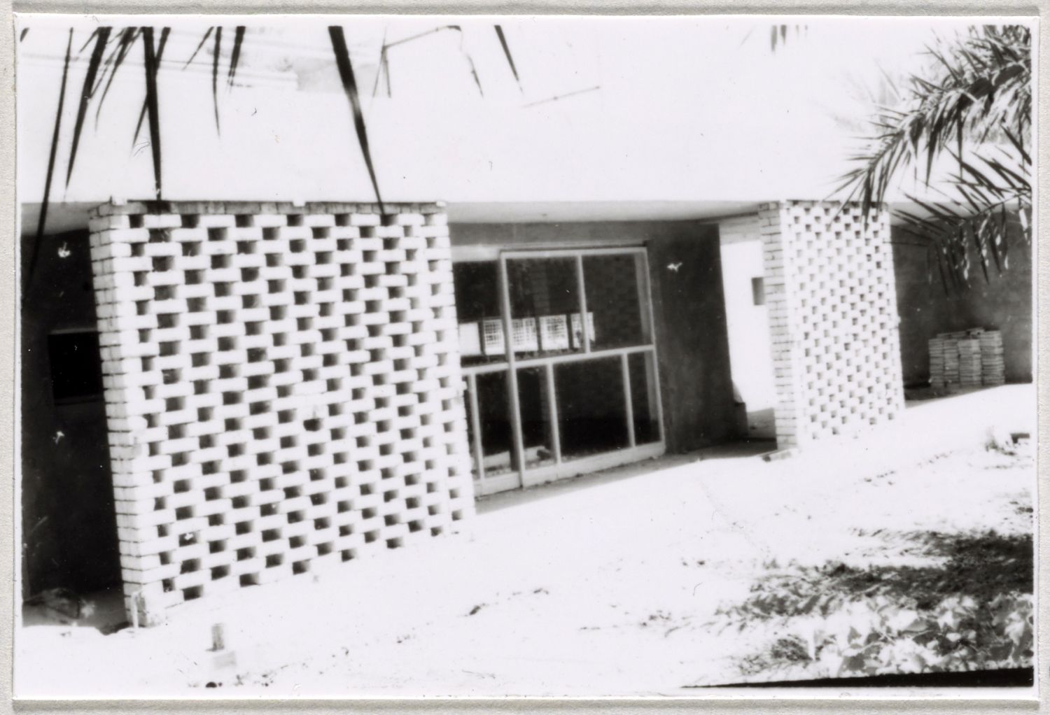 Exterior view of house during construction, showing porch.