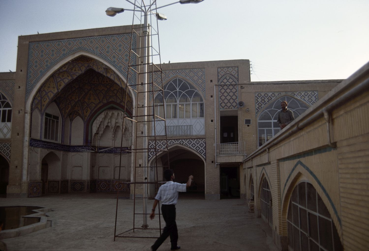Masjid-i Baba-Vali - View across courtyard facing southwest. The qibla iwan is visible at left, and the windows of the sardab-level prayer hall are visible at right.