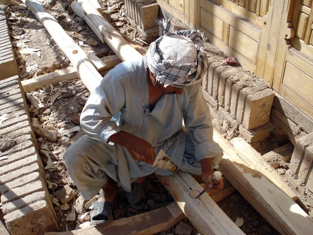 Carpenter working on the Attarbashi House restoration