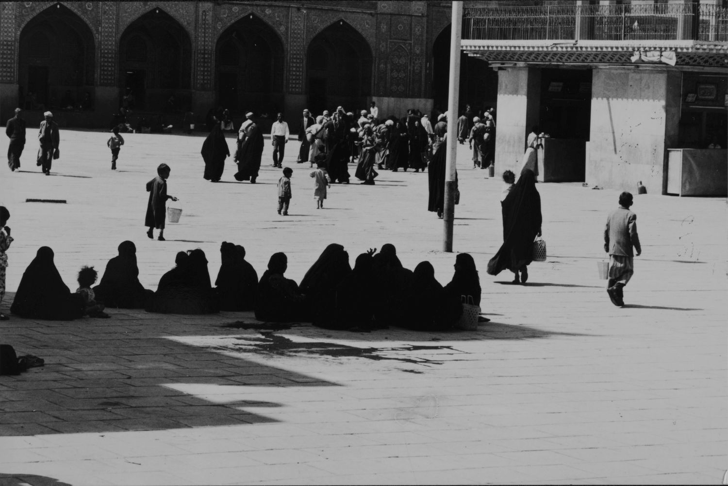<p>Women gathered in the courtyard of the Kazimiyya Shrine, Baghdad.</p>
