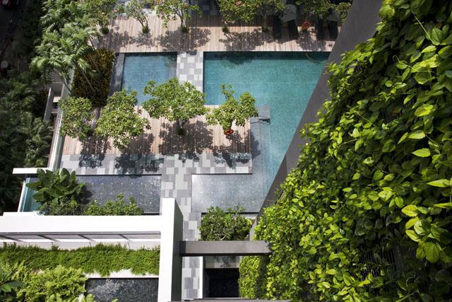 Landscaped surfaces. Viewed from above, the vertical walls, elevated gardens, environmental deck and ground level gardens form layered green surfaces