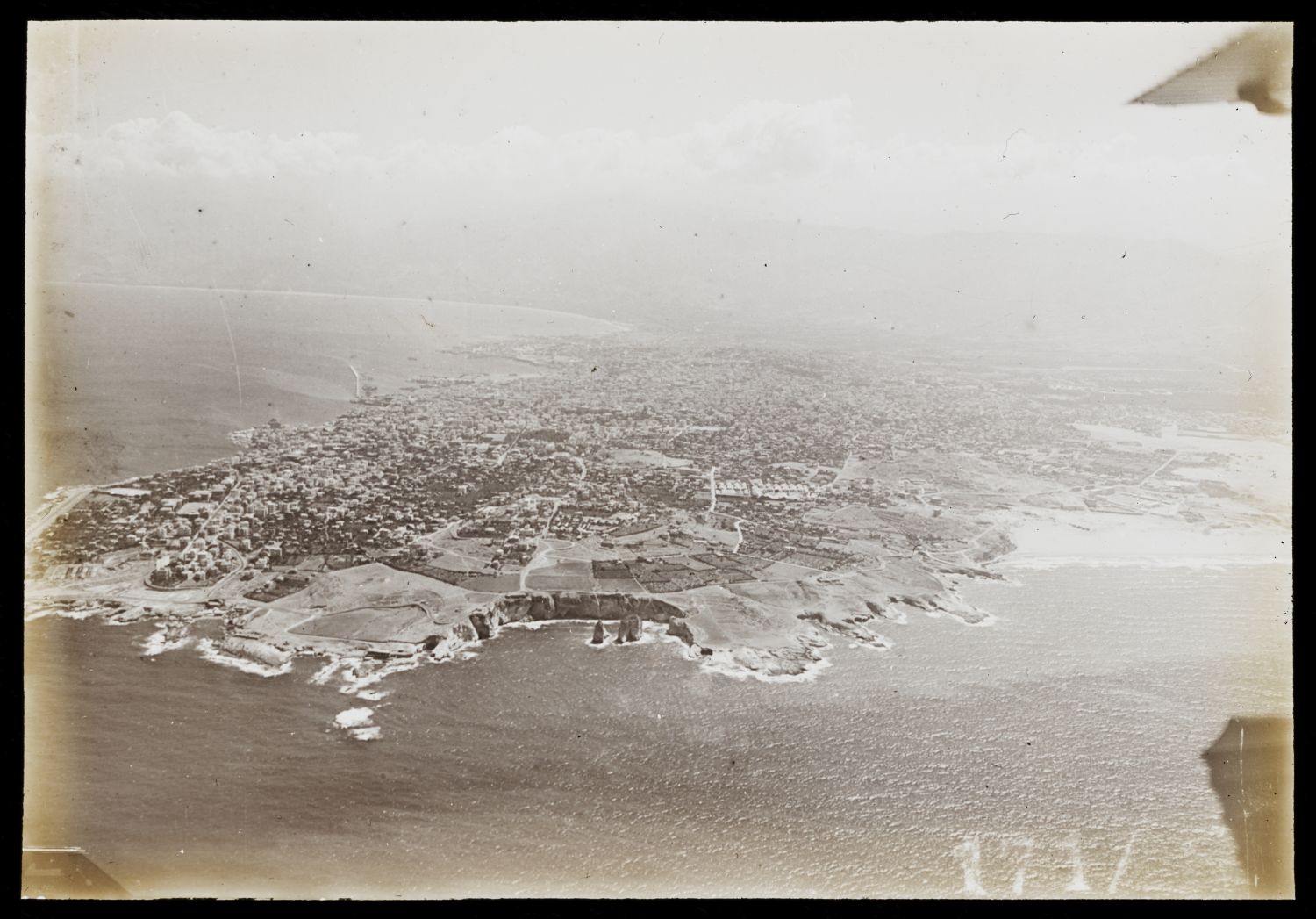 Aerial view of Beirut from west. Pigeon Rocks (Rouche) are visible in foreground.
