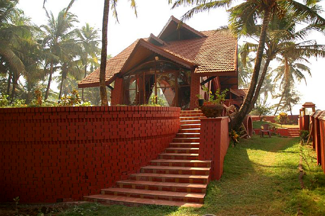 Exterior view of bungalow taken from the wall of the compound (the sea is located at right). The vault of one bedroom is visible at center right. Steps lead up from the garden to the main living area