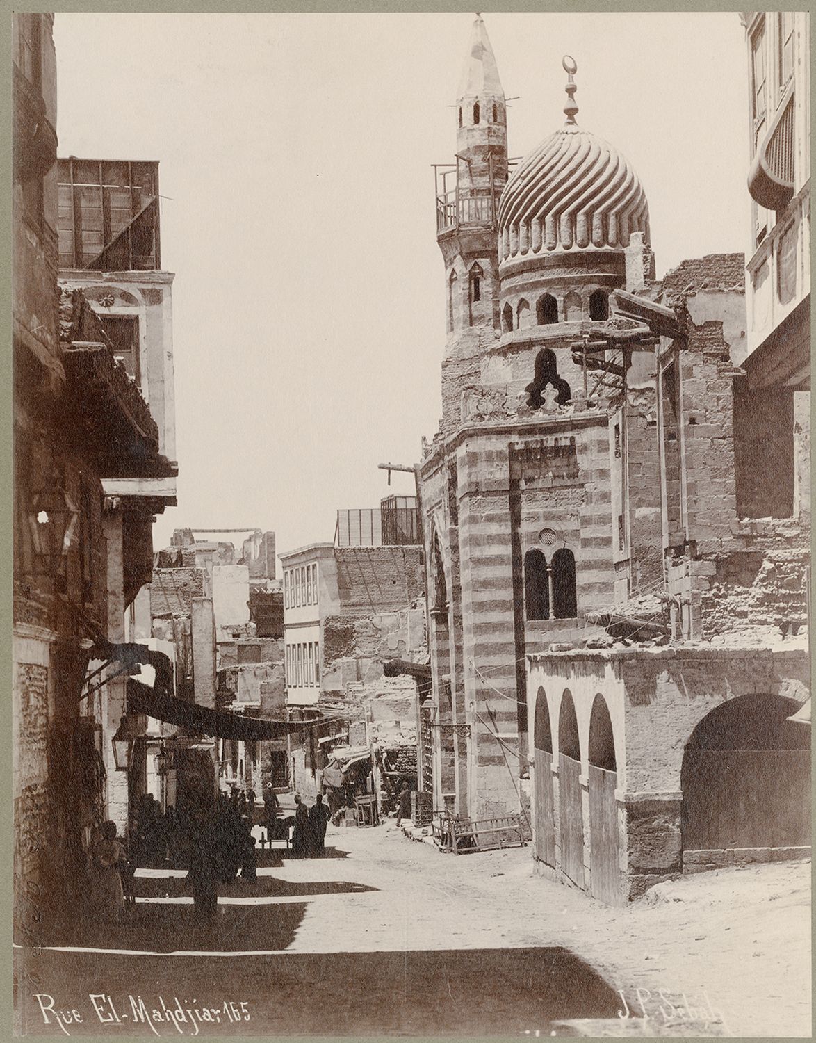 View along Mahjar Street in Cairo, Egypt. The Mosque of Amir Aytmish al-Bajasi is visible at right.