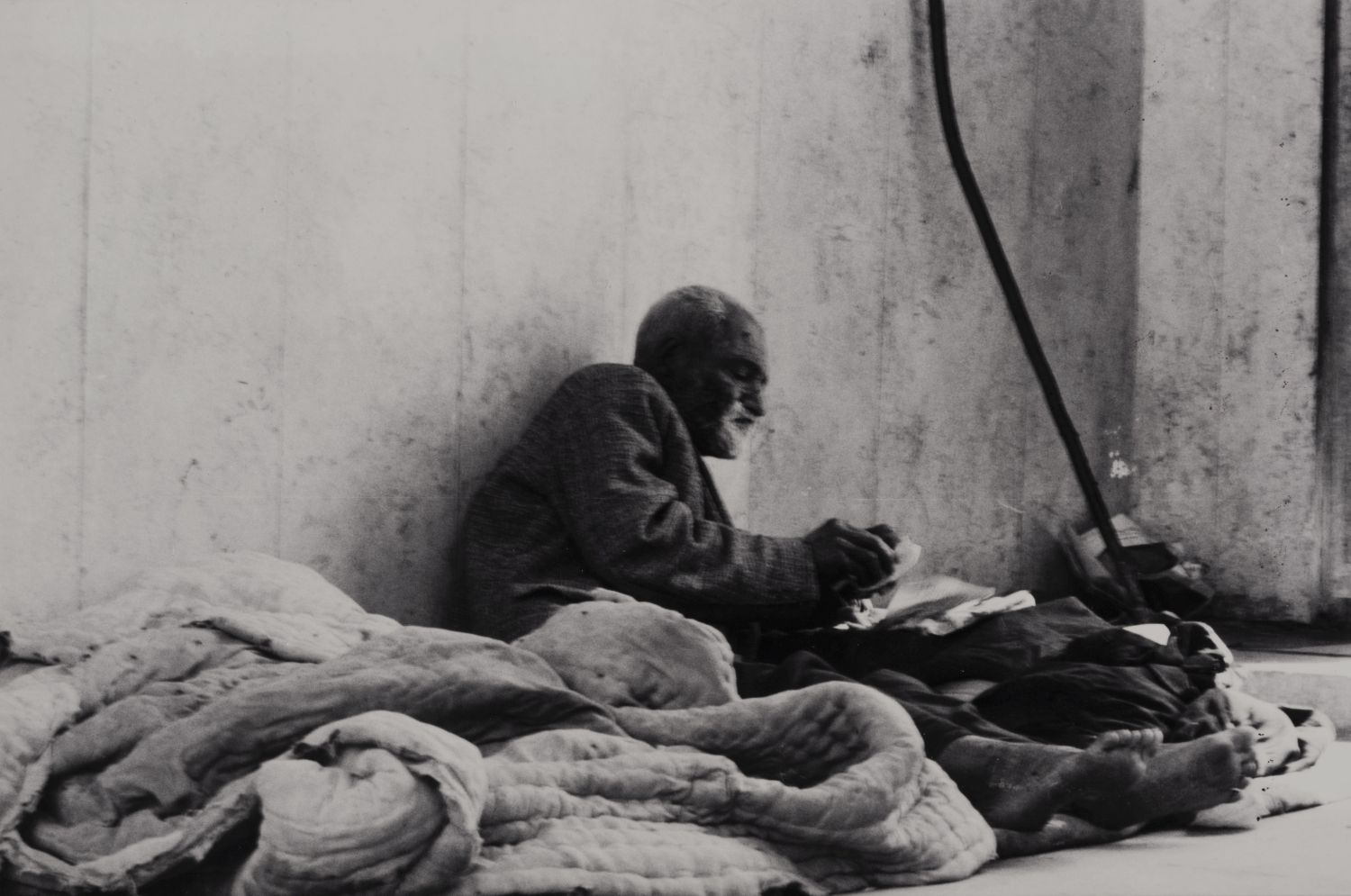 <p>Man on temporary bed in Kazimiyya Mosque.</p>