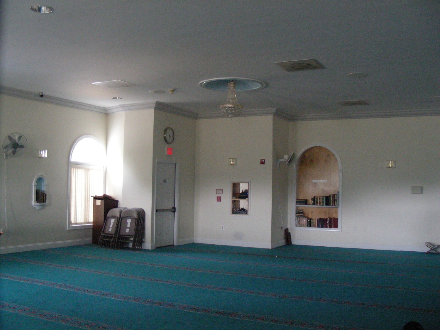 View to a corner of the prayer hall, with an entrance door
