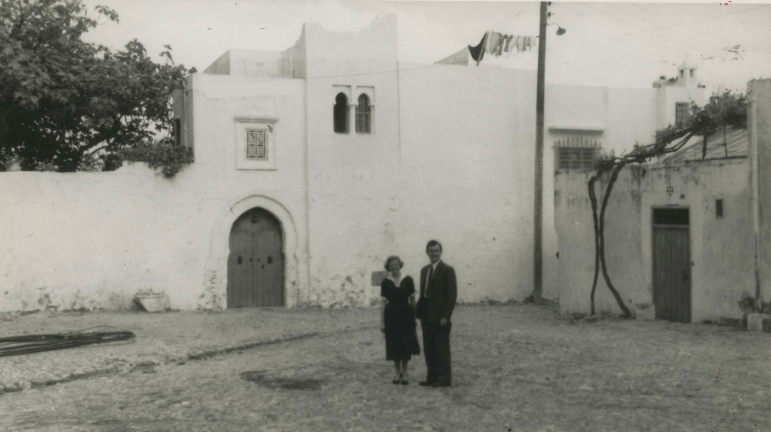 Stuart & Sylvia Gates in front of their residence at 0 Place de la Casbah, Bab al-Assa to the right