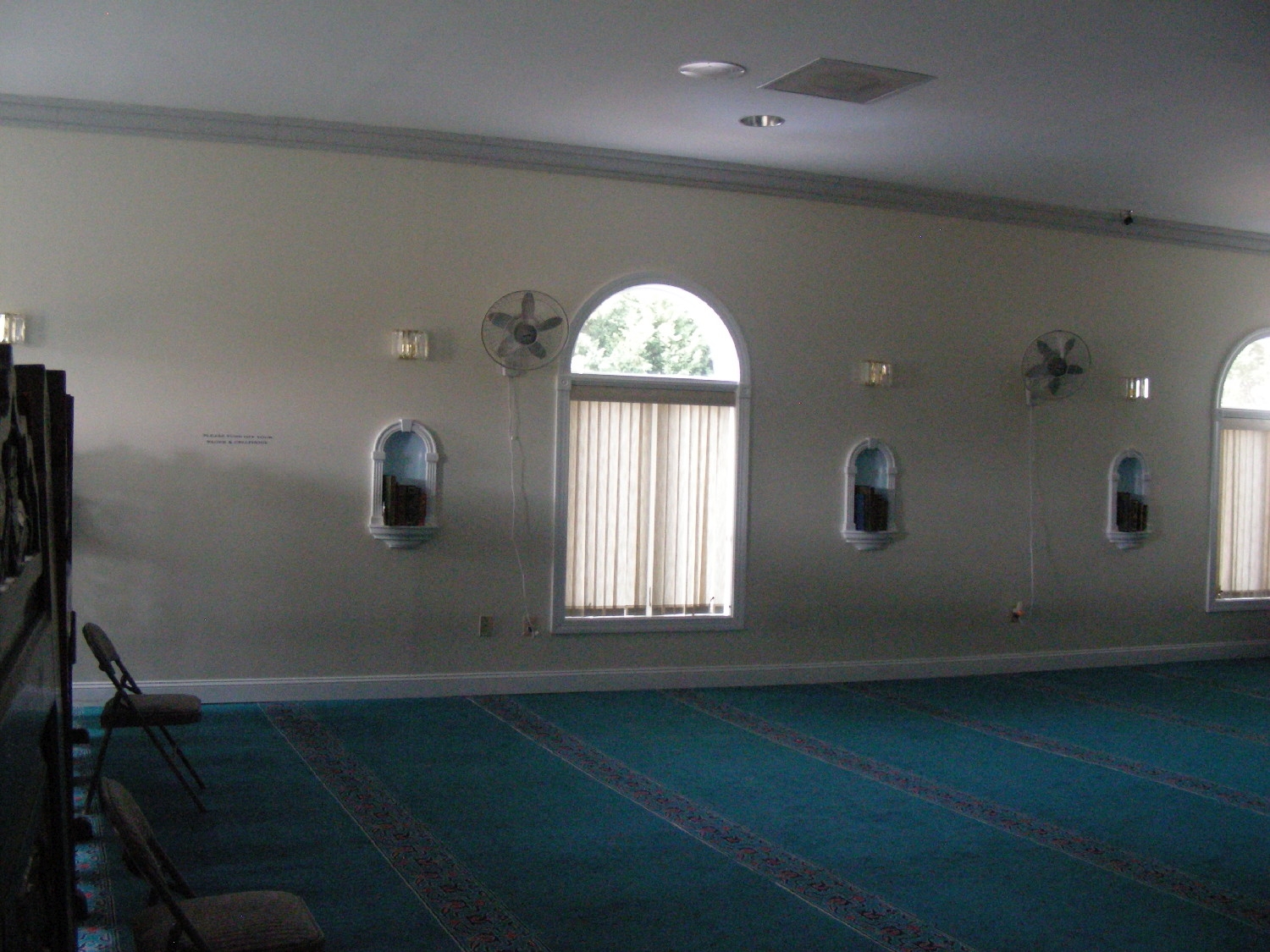 Prayer hall, detail of window and niches with books