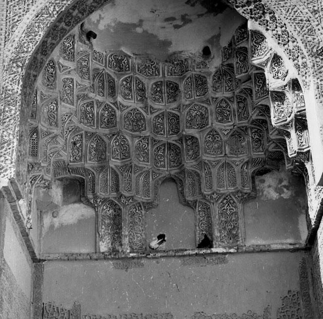 Detail view of the muqarnas and stucco decoration on the entrance iwan