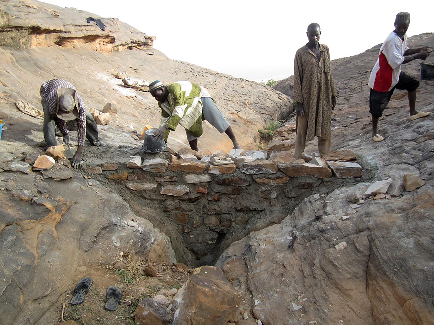Construction process of the new dam built with local stones