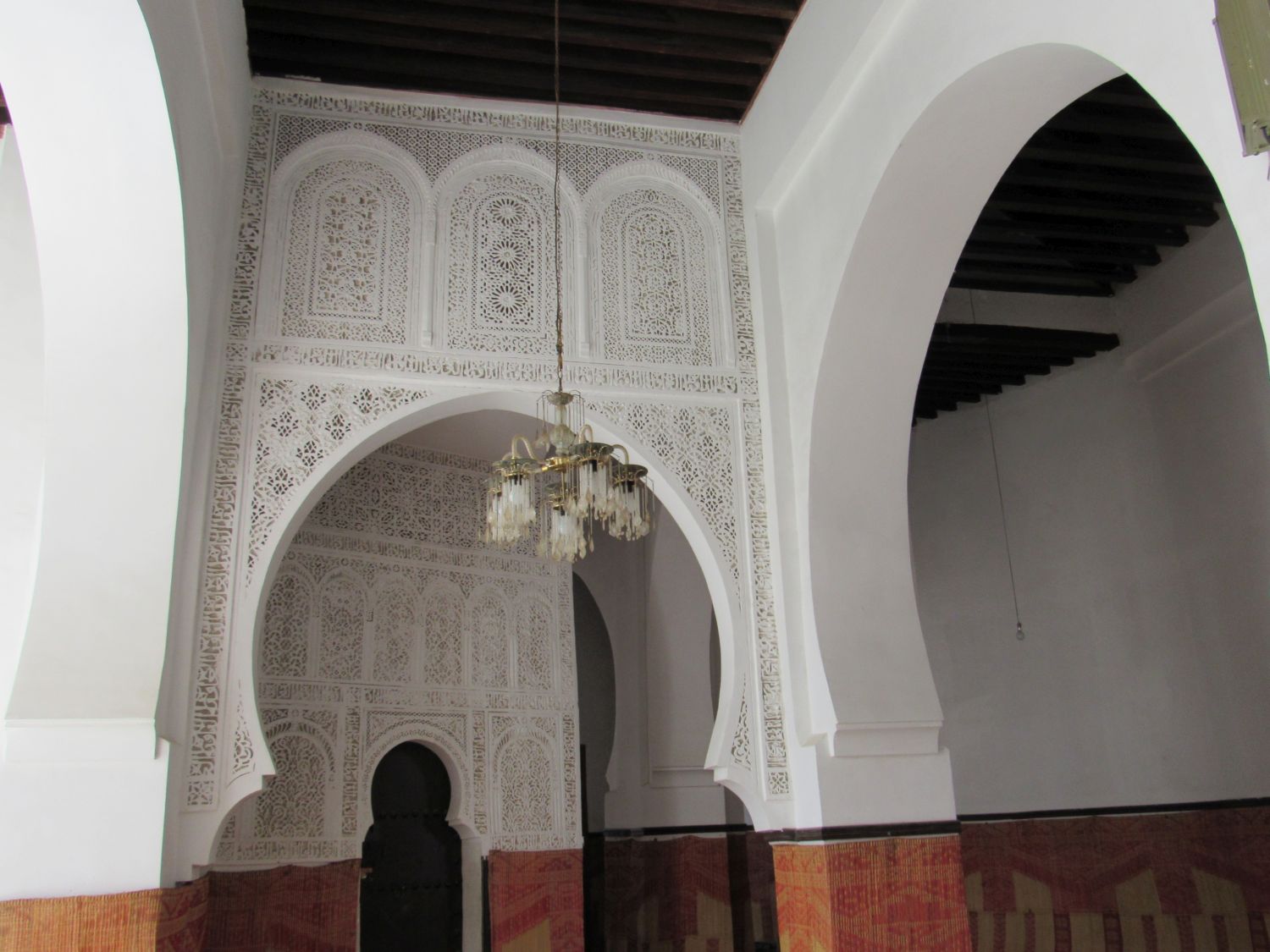 Interior view, hallway arch decorated with carved geometric patterns
