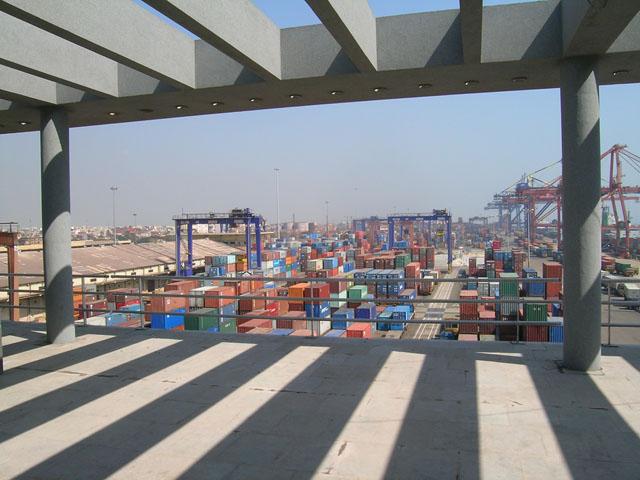 Framed view of container terminal from pergola covered terrace