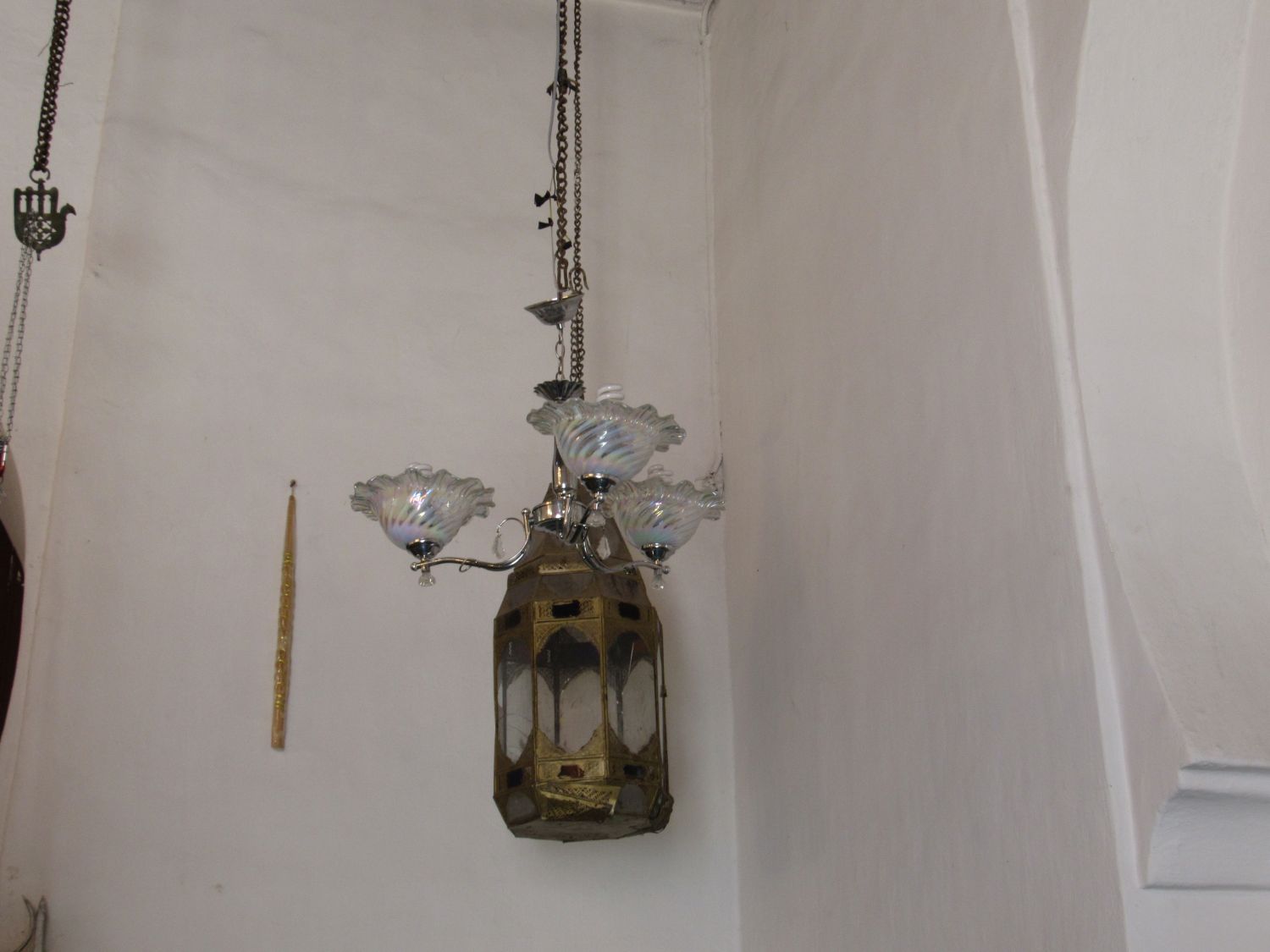 Interior view, prayer hall oil lamp made of brass, silver, and glass