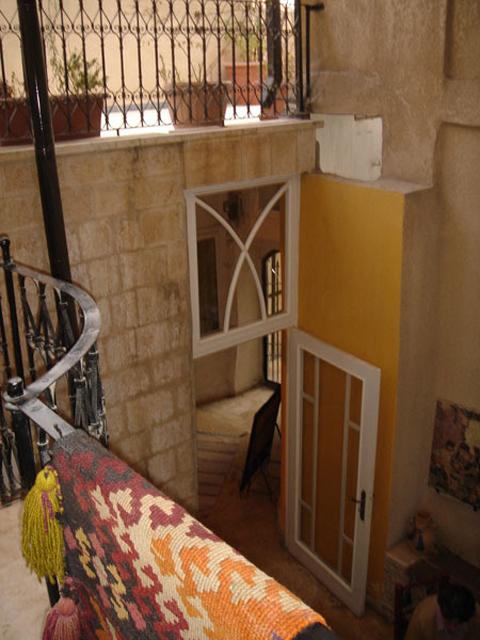 Overview of the second floor to the renovated door that separates the outer yard from the inner yard