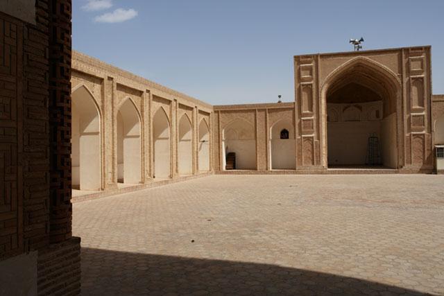 Exterior view from the courtyard looking northwest, showing the north iwan and a riwaq along the longitudinal axis