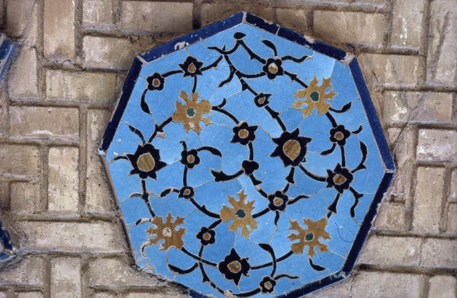 Detail of an octagonal tile mosaic panel.