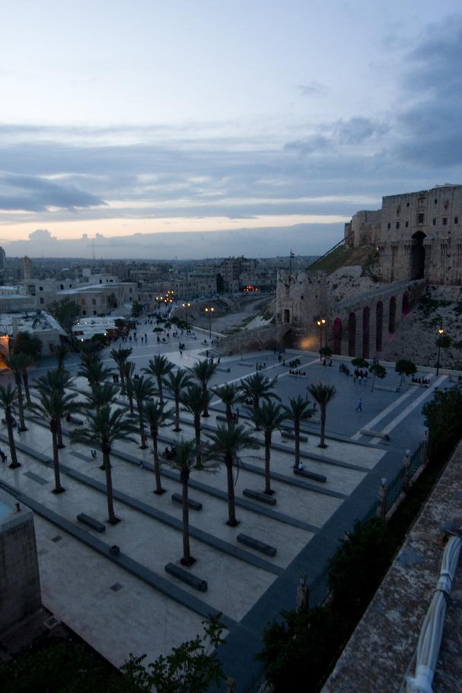 Aleppo Citadel Perimeter Rehabilitation - Dusk view of plaza in front of entrance tower and gate