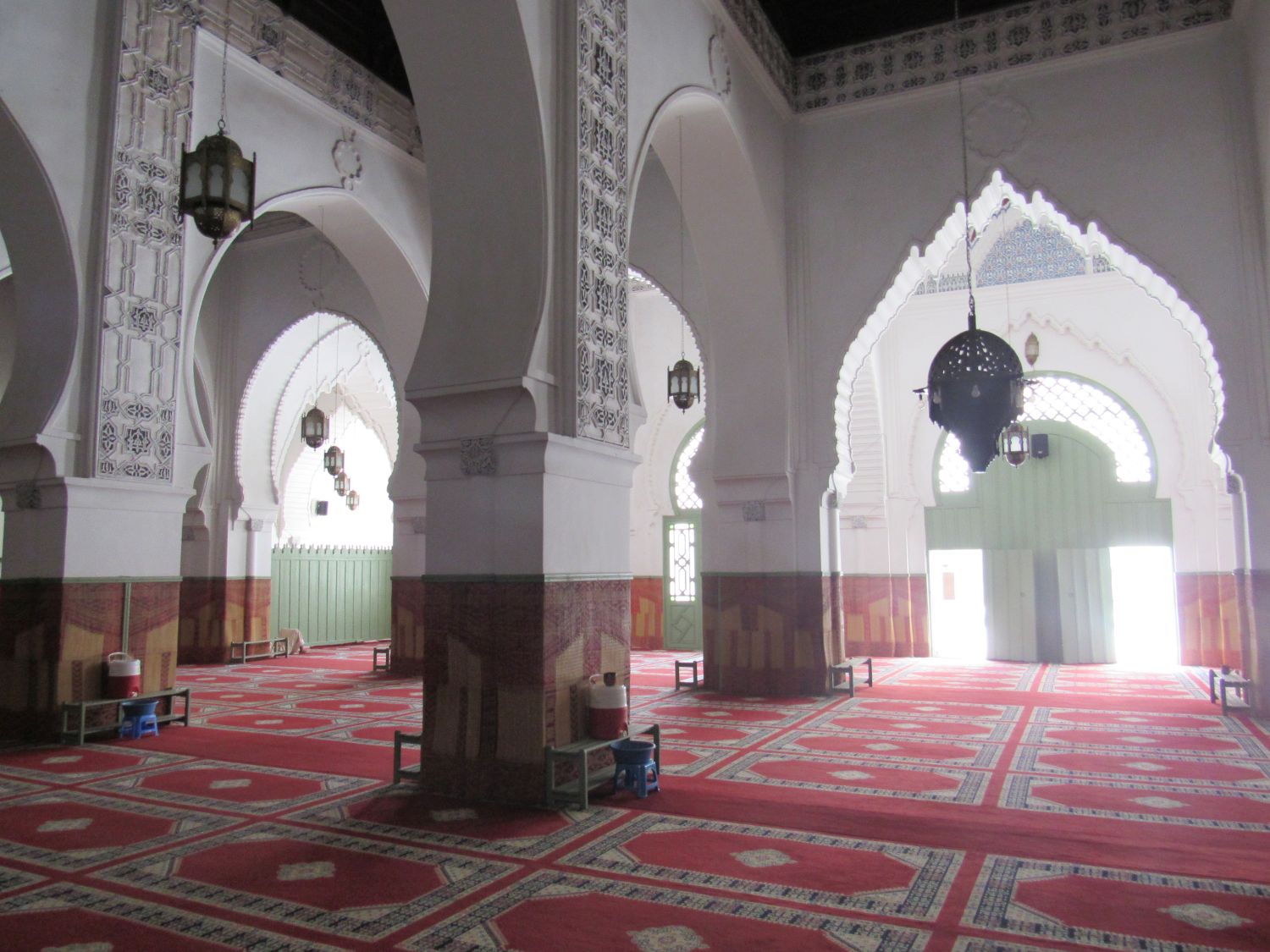 Interior view, prayer hall and mugarnas embellished arches.