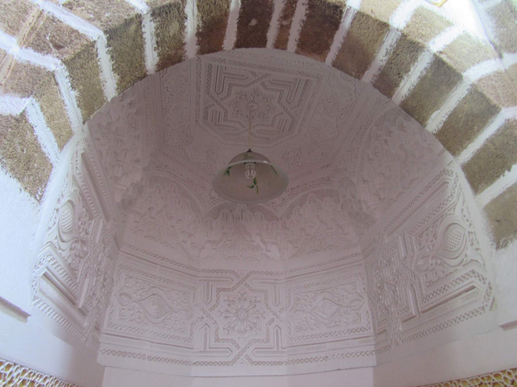 Detail view of decoration in the semi-dome of the mihrab niche