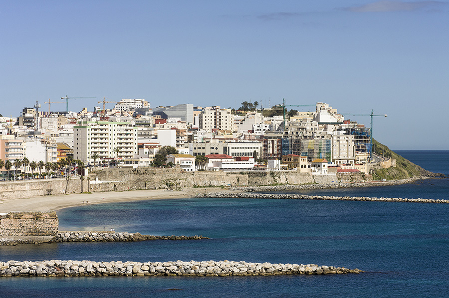 The city and the library seen from Ceuta south bay. A mix of typical European-style apartment buildings from the 19th to the 21st centuries, much of the architecture of Ceuta is indistinguishable from the architecture of most other small and medium sized towns and cities in Europe










