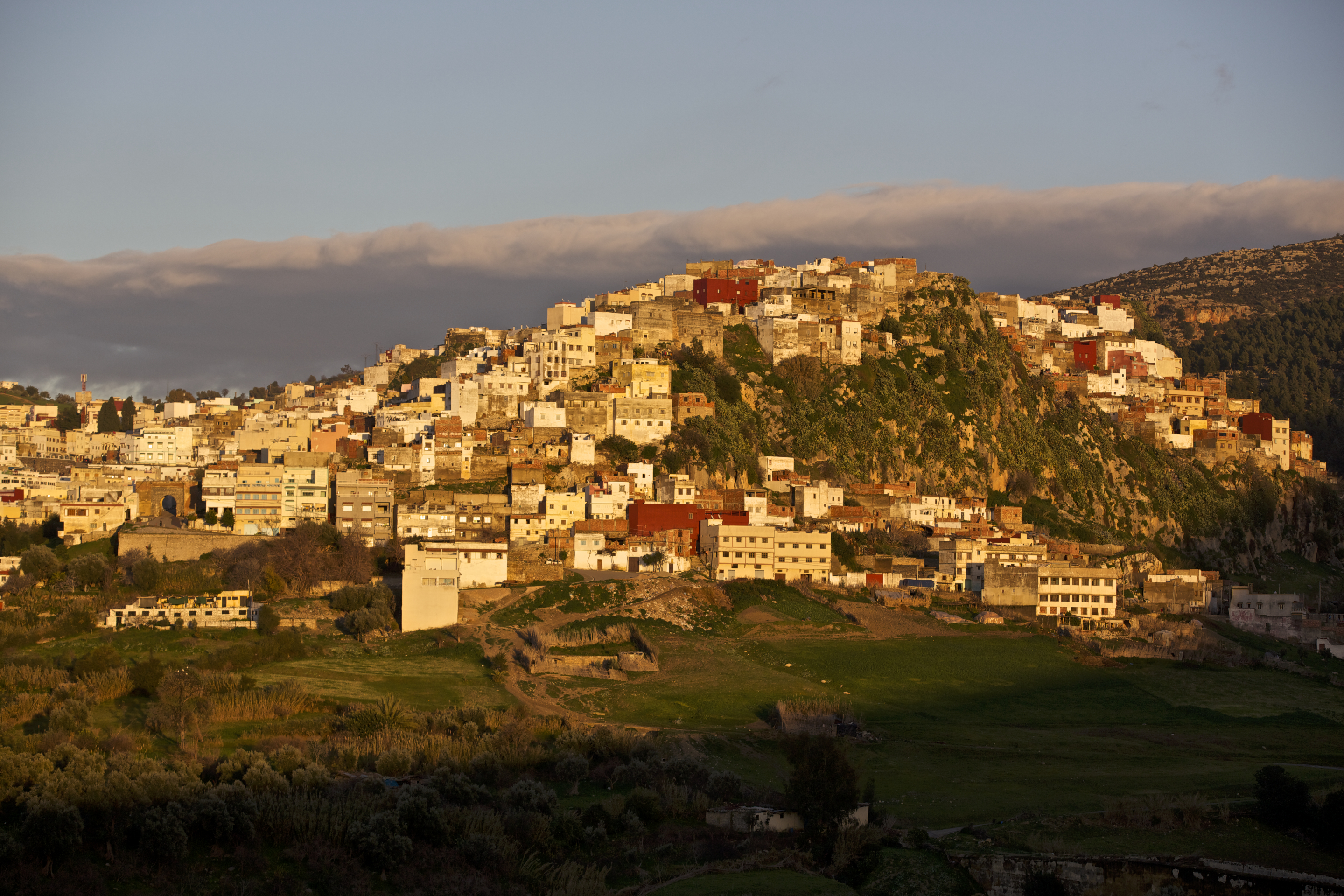 View of Moulay Idriss Zerhoun with old walls and new construction