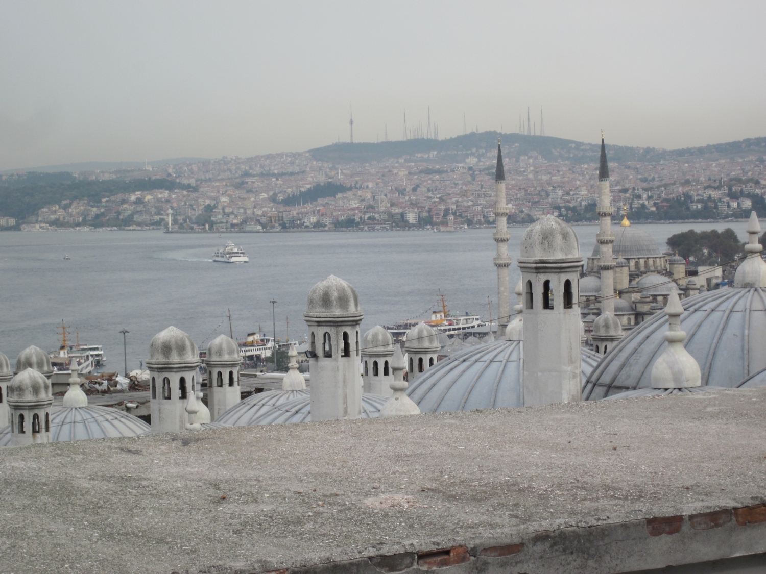 Süleymaniye Külliyesi - View looking over domes and chimneys of the Suleymaniye Camii to the Bosporus and city along its banks