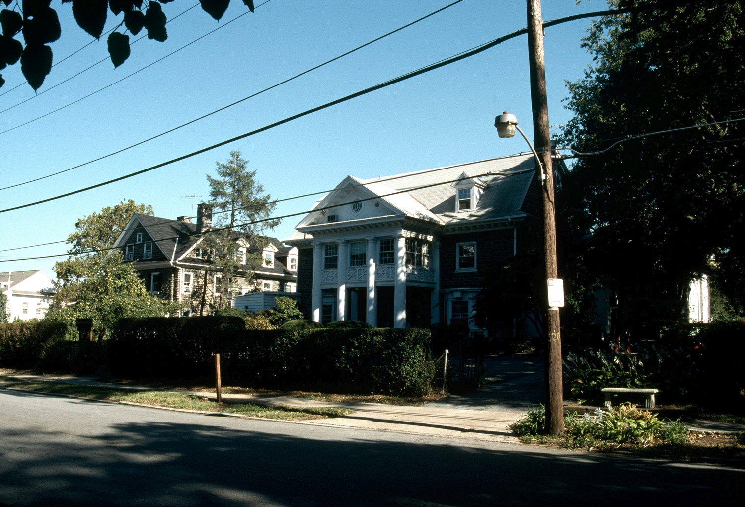 View from street, looking east, showing situation in surrounding residential neighborhood