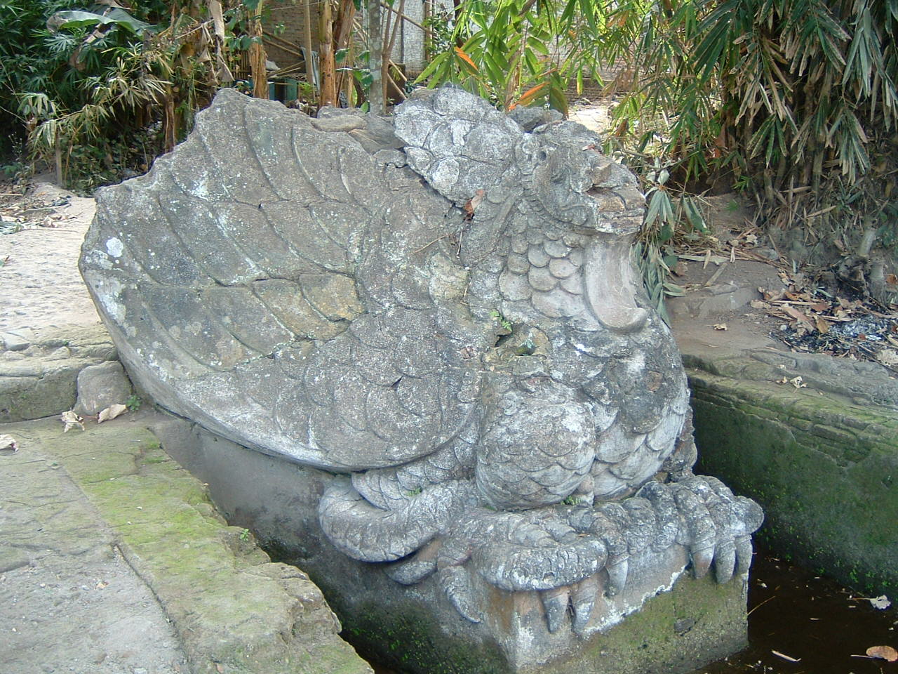 Detail view looking northwest showing the western sculpture representing mythical bird (garuda)