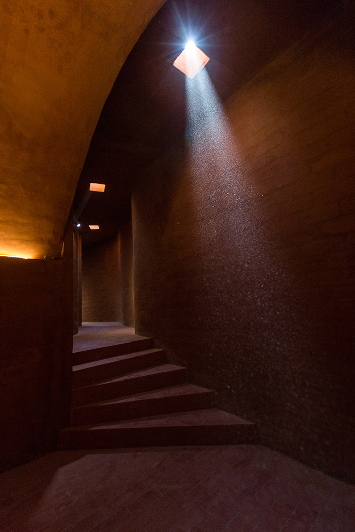 View of the corridor leading to the cellar, illuminated by natural light