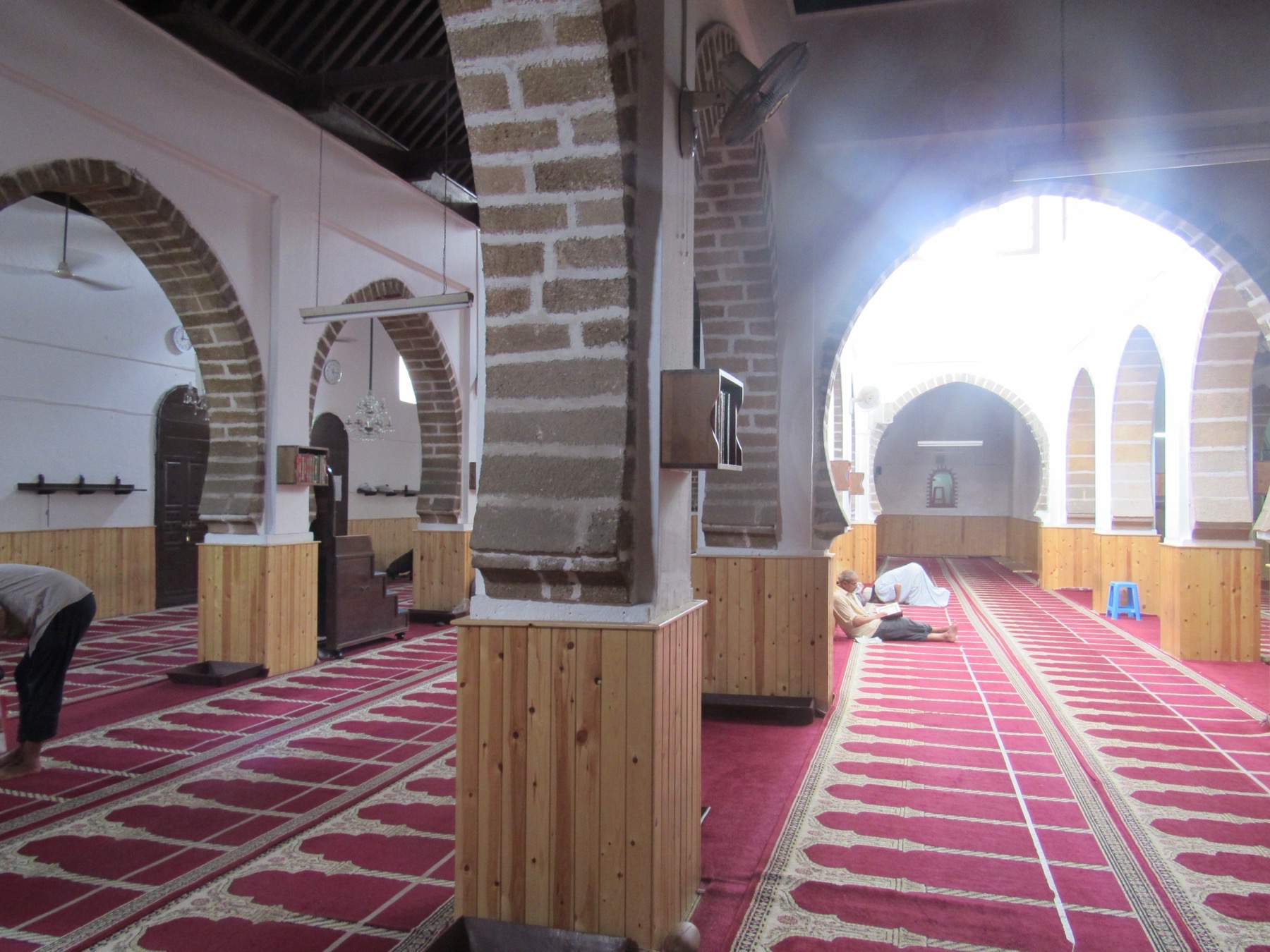 Interior view of the prayer hall showing the brickwork on the arches