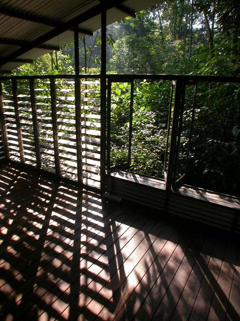 Louvered-glass window providing shadow cast on floor