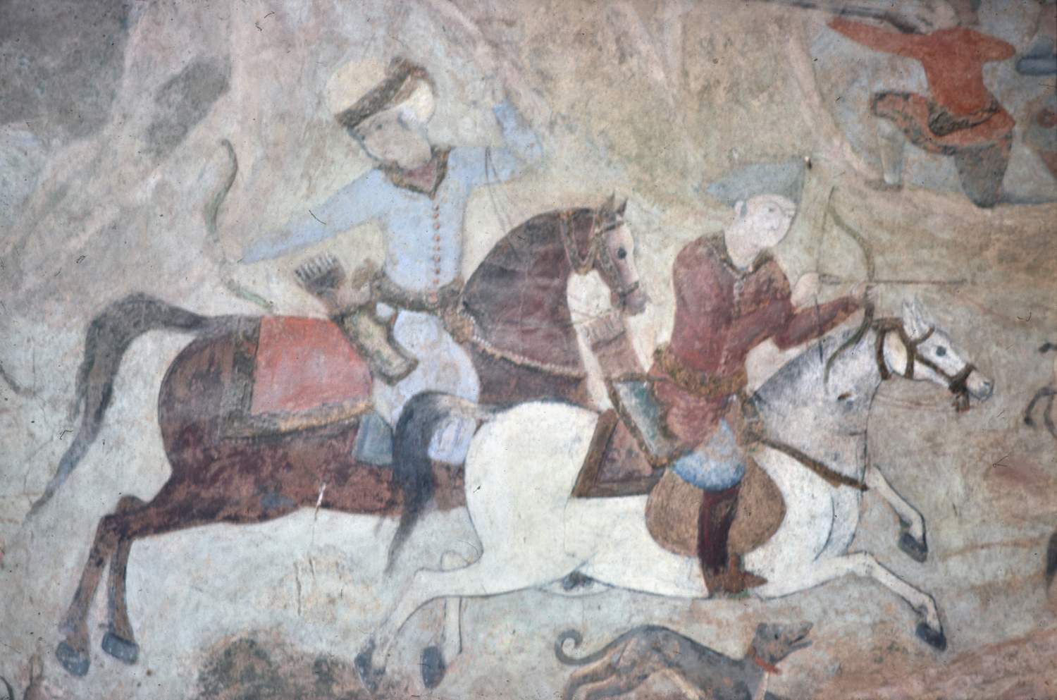 Detail of hunt scene wall painting, showing horsemen shooting arrows. 