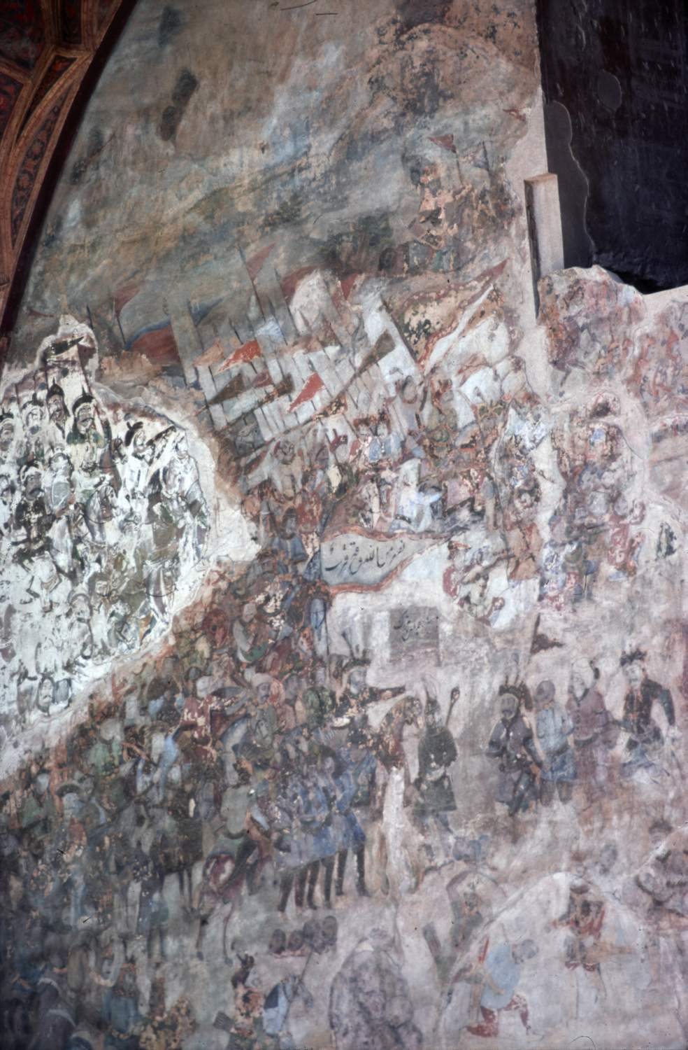 Detail of wall paintings on back wall of iwan.