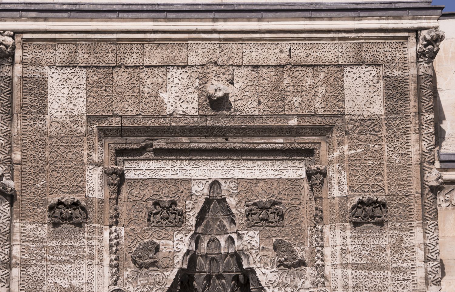 Entrance portal: view of upper half of facade showing geometric ornament.