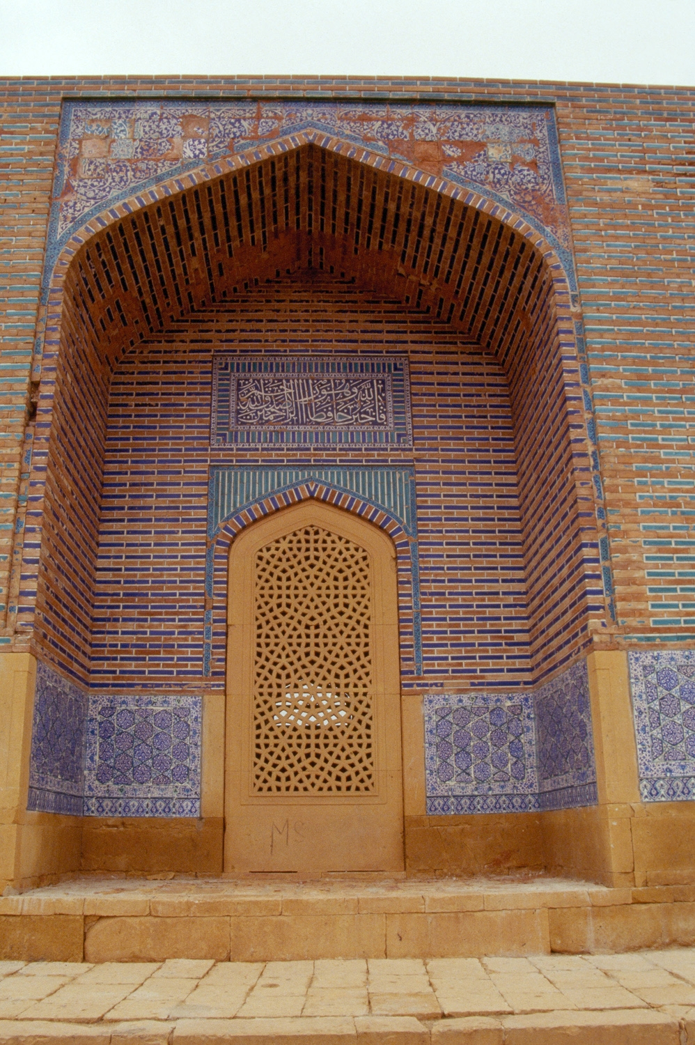 Exterior, carved sandstone entry door to tomb