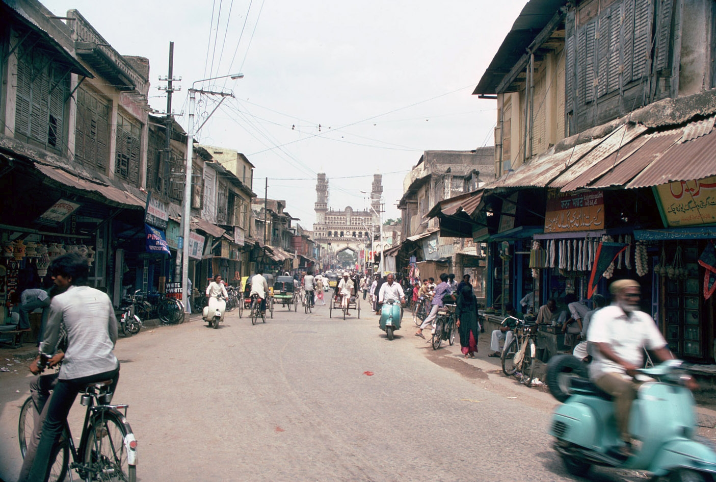 View of the approach to Char Minar from the west through the bazaar, shops on either side of the street