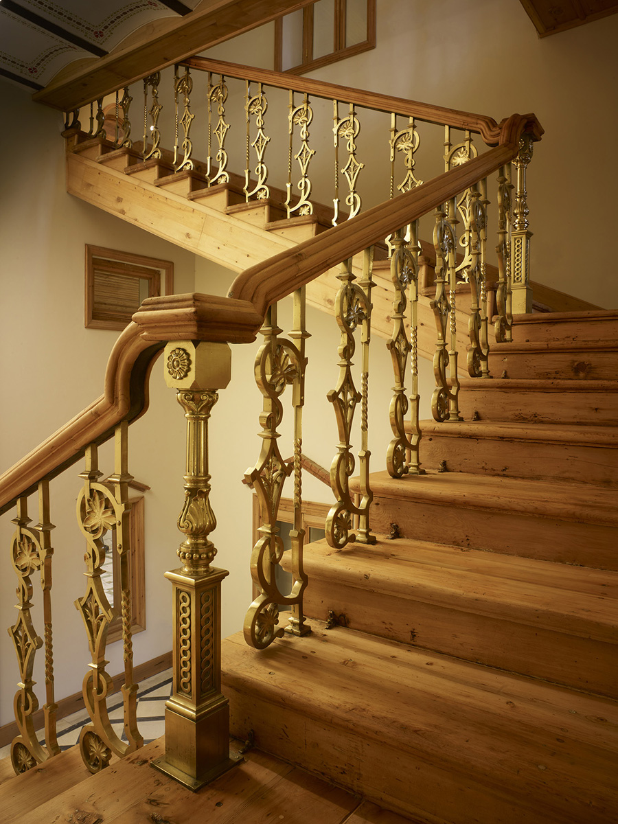Interior, detail of stairwell and railing following restoration