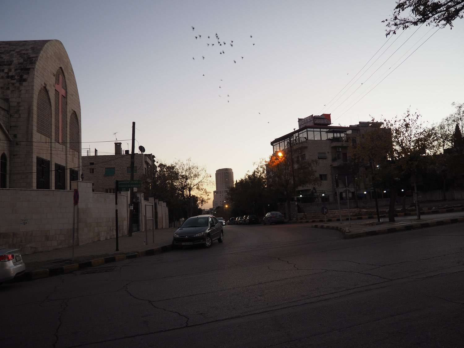 View down Ibn Hazen al-Andalusi St past the Coptic Orthodox Church toward the Le Royal Hotel