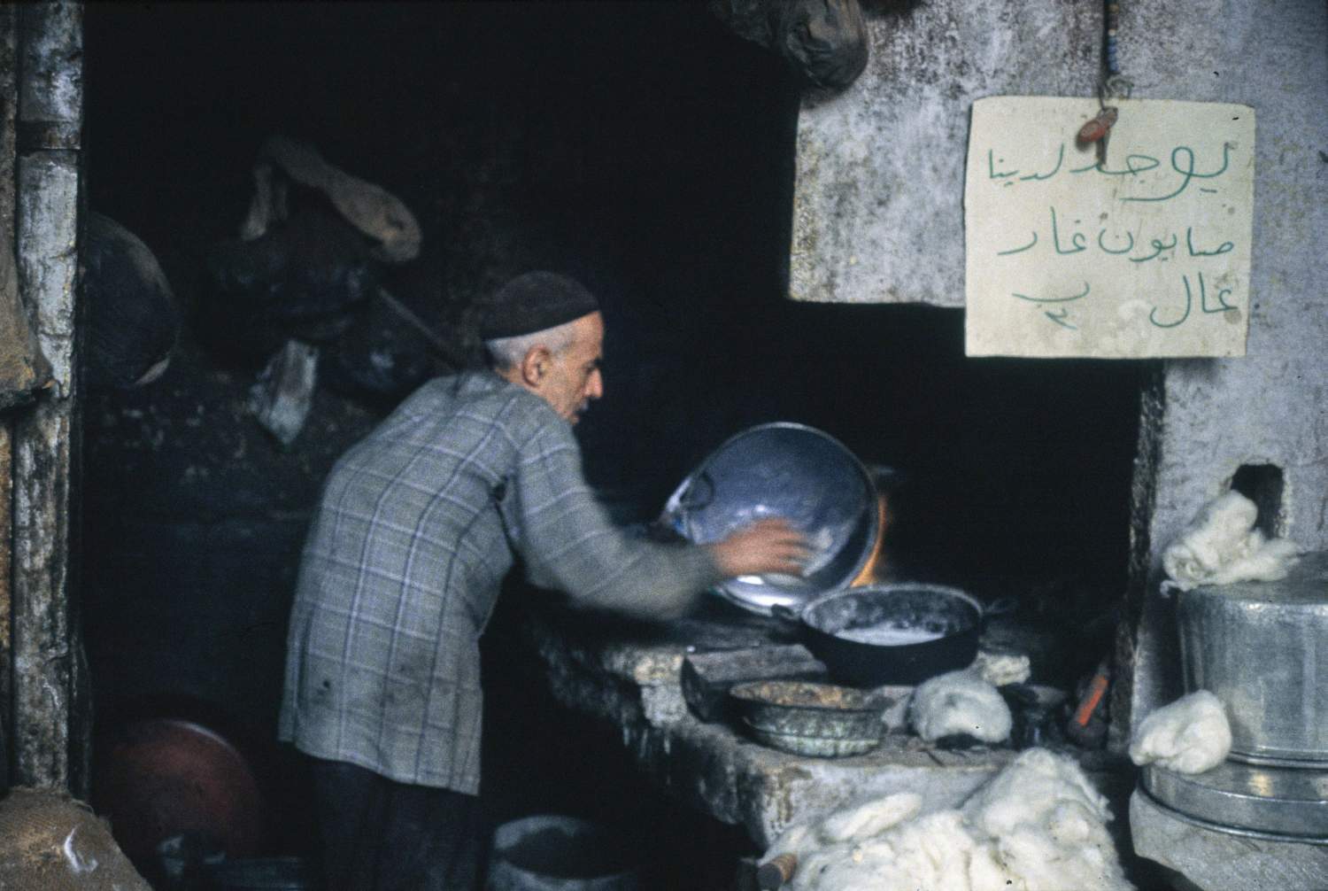 Man in shop with sign advertising laurel soap.