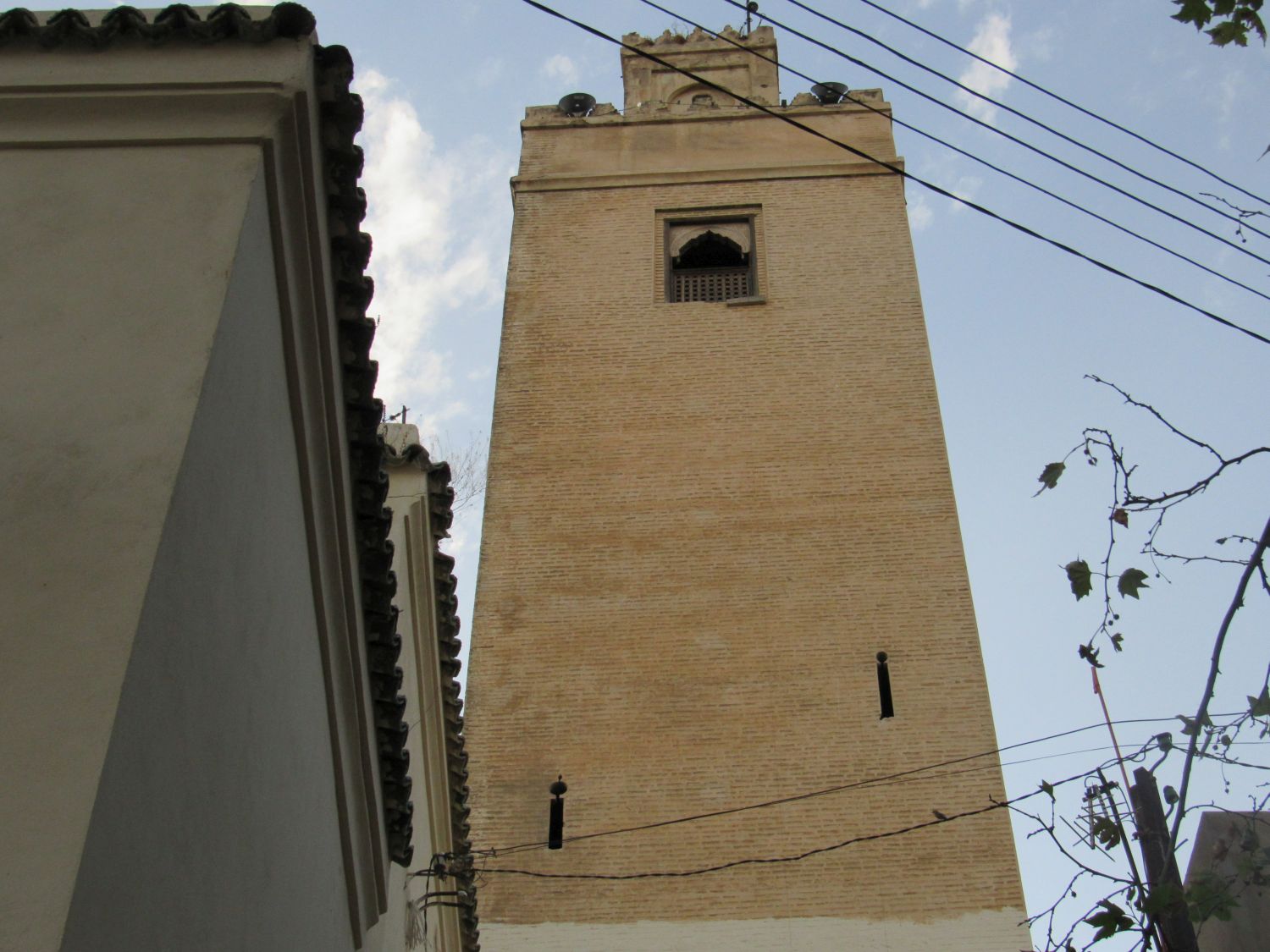 Bab Guissa Mosque and Madrasa - Exterior, upward view of the minaret