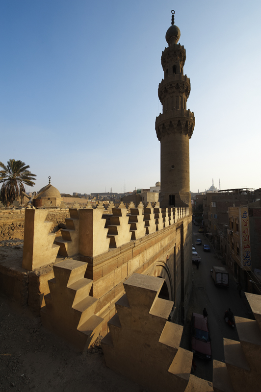 View of rooftop crenellations and minaret