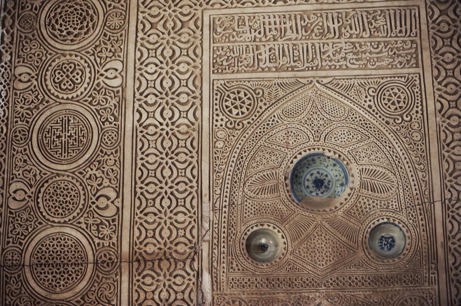 View of carved stucco decoration on mihrab.